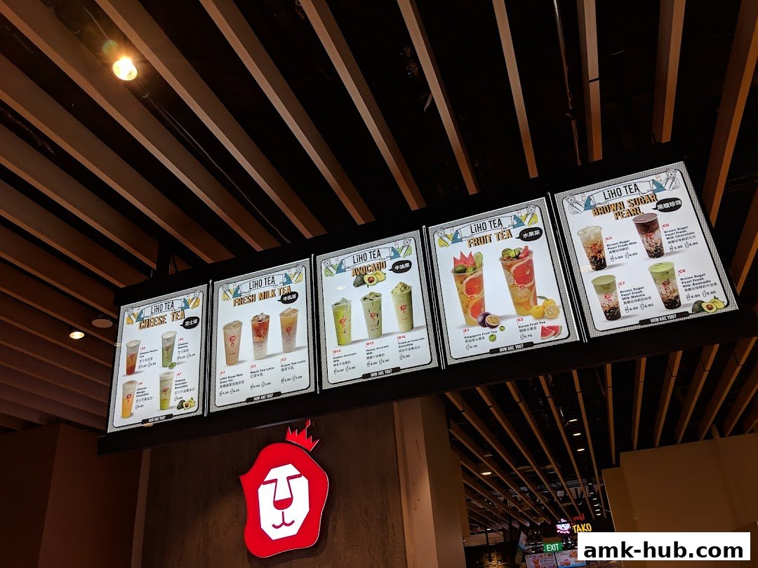 A menu board displaying various LiHO TEA drinks, including cheese tea, fresh milk tea, avocado, fruit tea, and brown sugar pearl.