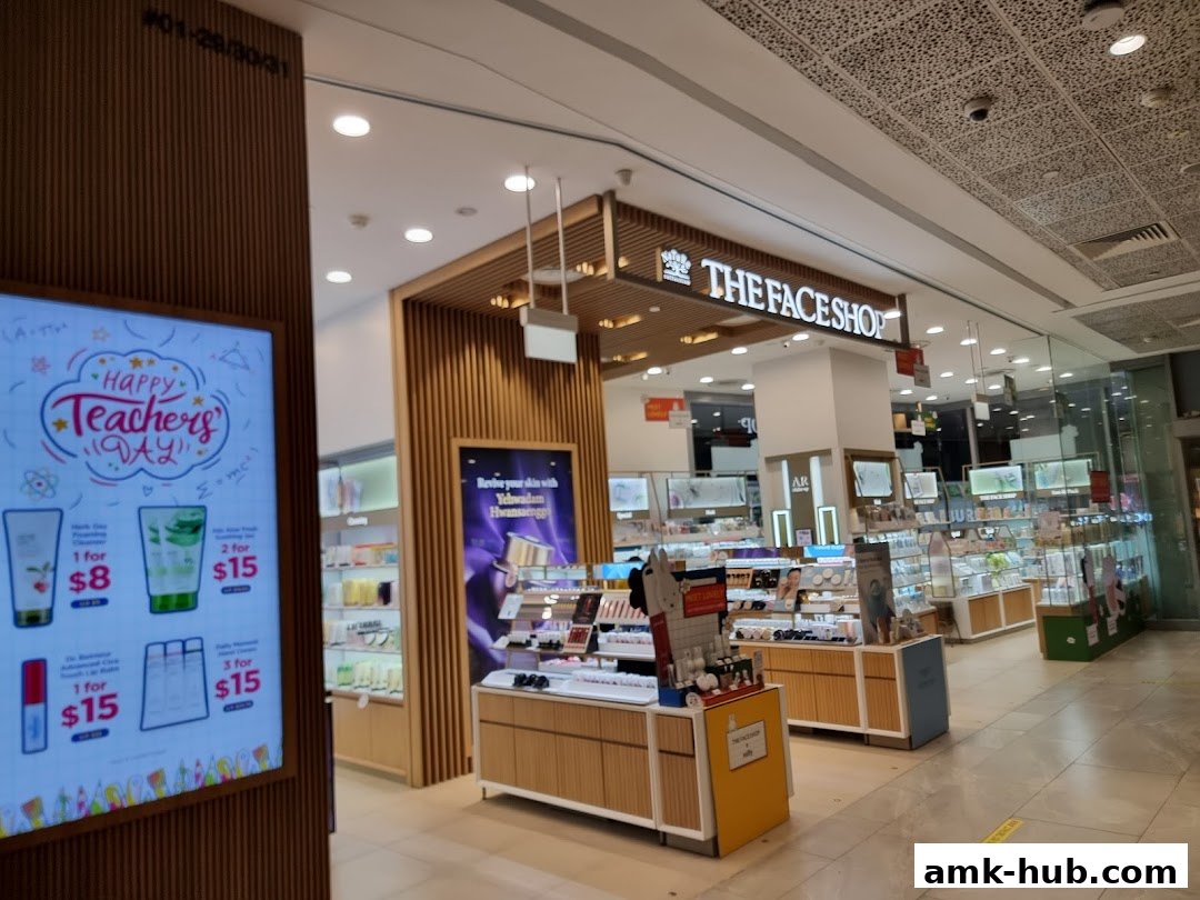 The Face Shop store interior with displays of skincare products and a promotional screen.
