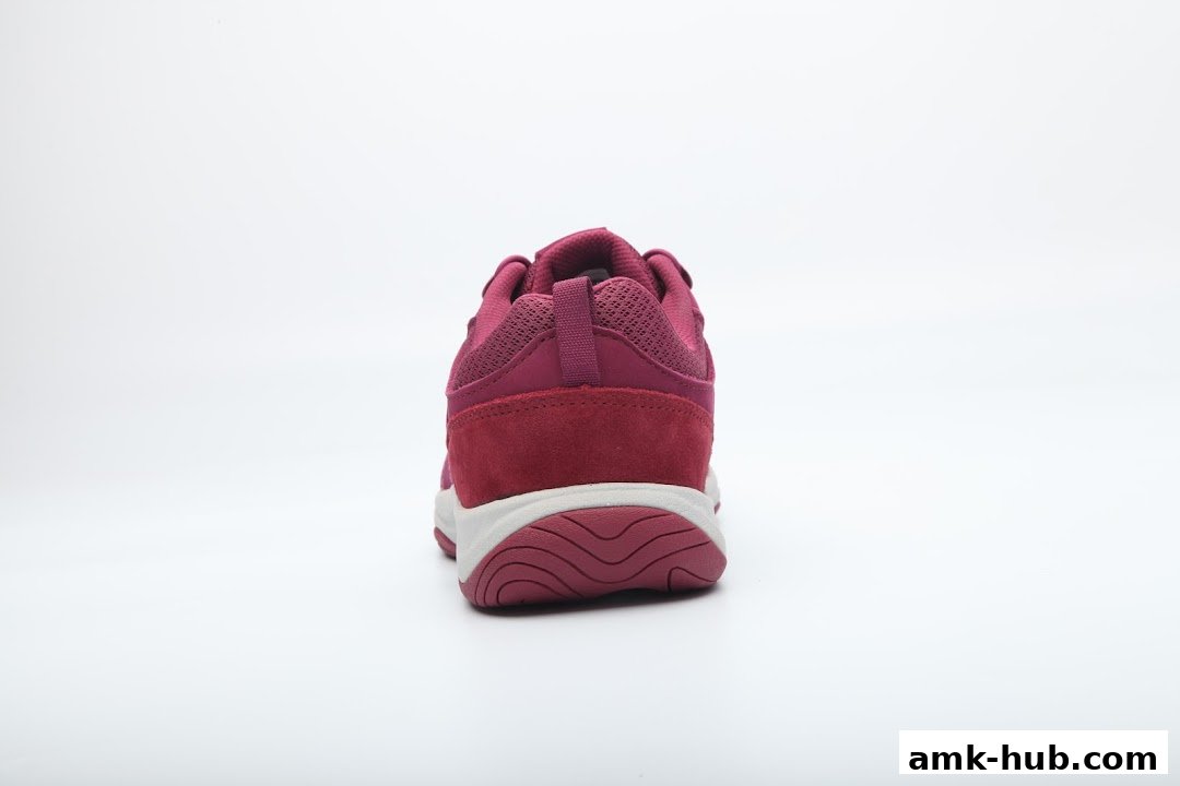 A close-up rear view of a maroon and white athletic shoe against a white background.