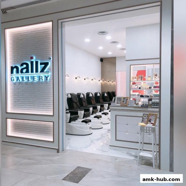 The entrance to Nailz Gallery, showcasing a clean and modern interior with manicure stations.