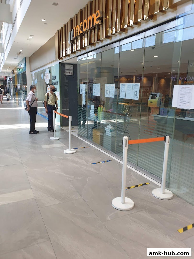 The entrance of Income Insurance Ang Mo Kio Branch with social distancing markers.