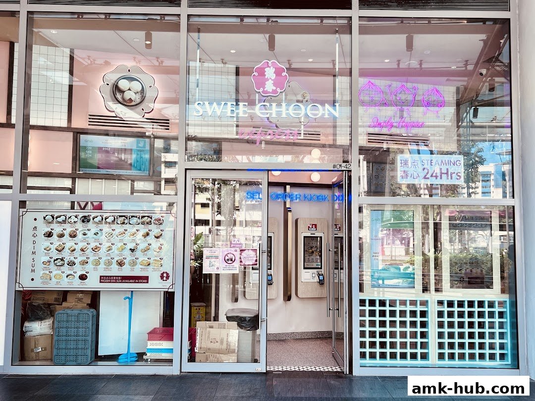 The exterior of Swee Choon Tim Sum Restaurant Express with a menu board and order kiosks.