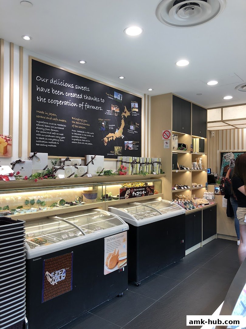 Interior view of a Châteraisé shop with display freezers and shelves stocked with sweets.