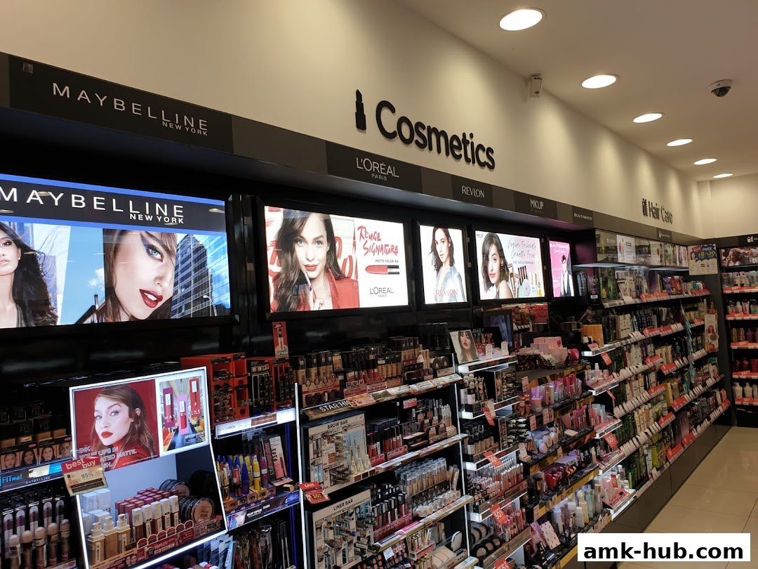 A well-stocked cosmetics store featuring displays from Maybelline, L'Oréal, and Revlon.