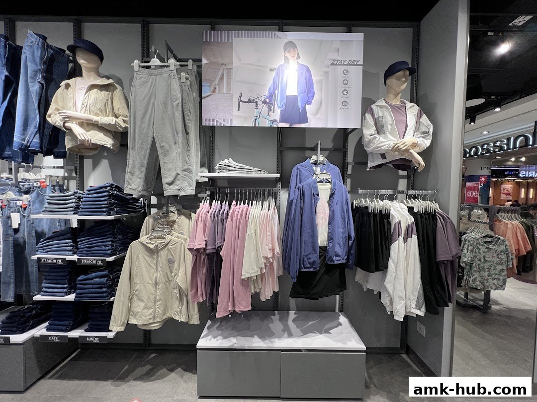 Interior view of a Bossini clothing store showcasing a variety of apparel on display.