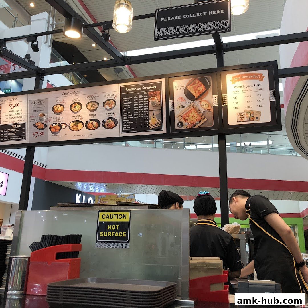 A menu board displays various local delights and traditional favorites with prices.