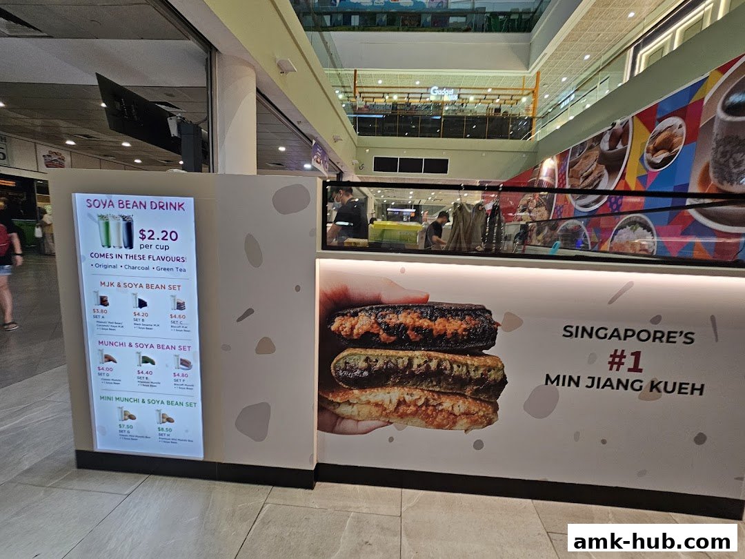 A food stall in a mall featuring a menu for soya bean drinks and min jiang kueh.
