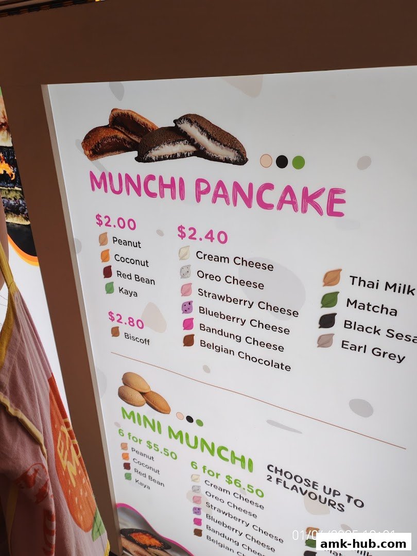 A menu board for Munchi Pancakes, showcasing various flavors and prices.