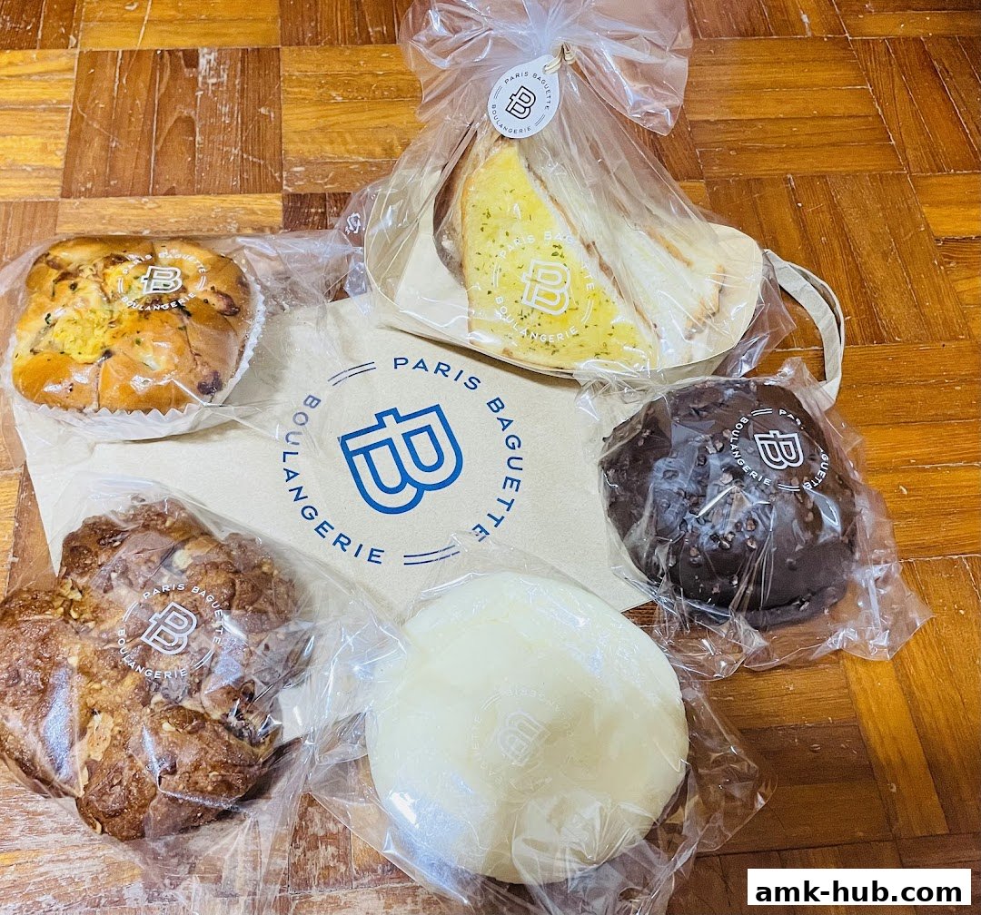 A collection of freshly baked pastries and sandwiches from Paris Baguette.
