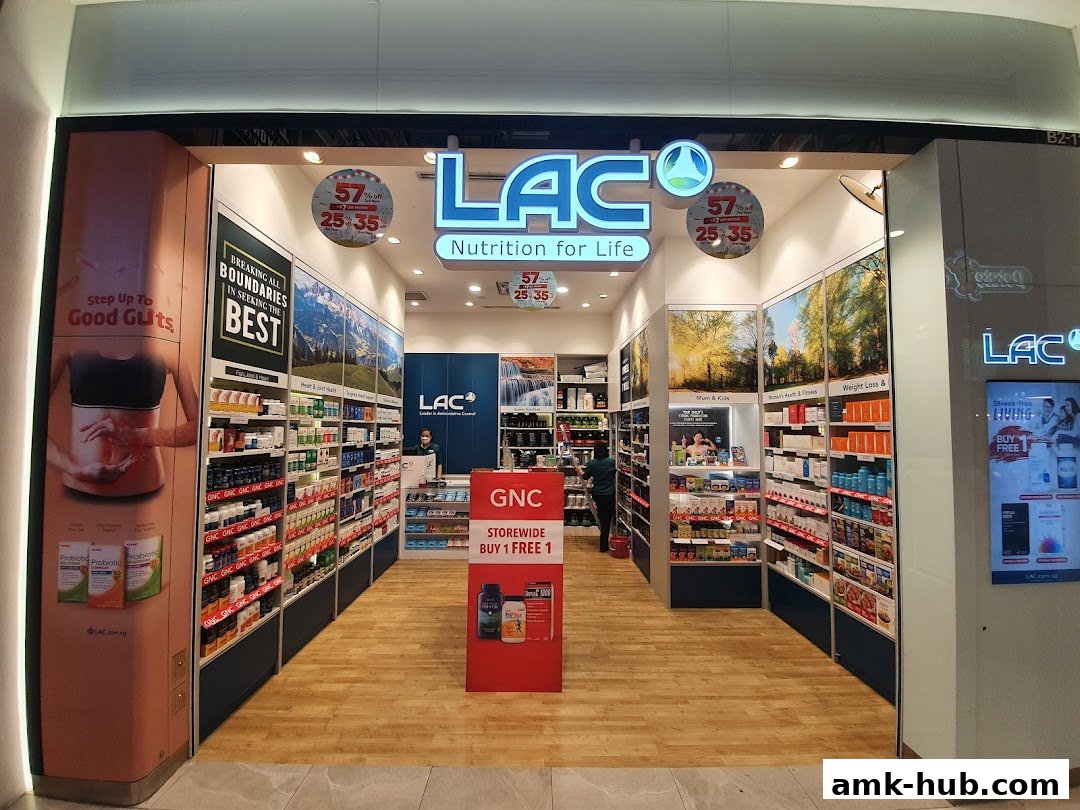 The entrance of LAC Nutrition For Life, a health and wellness store, showcasing shelves of supplements and promotional displays.