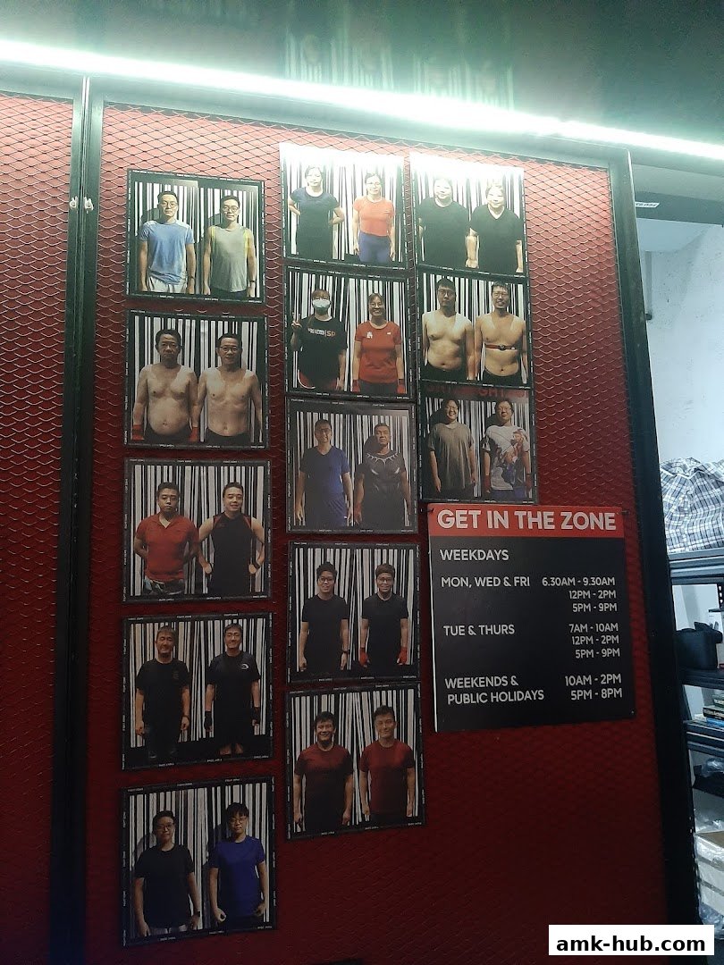 A wall display featuring photos of people and operating hours for a fitness or training facility.