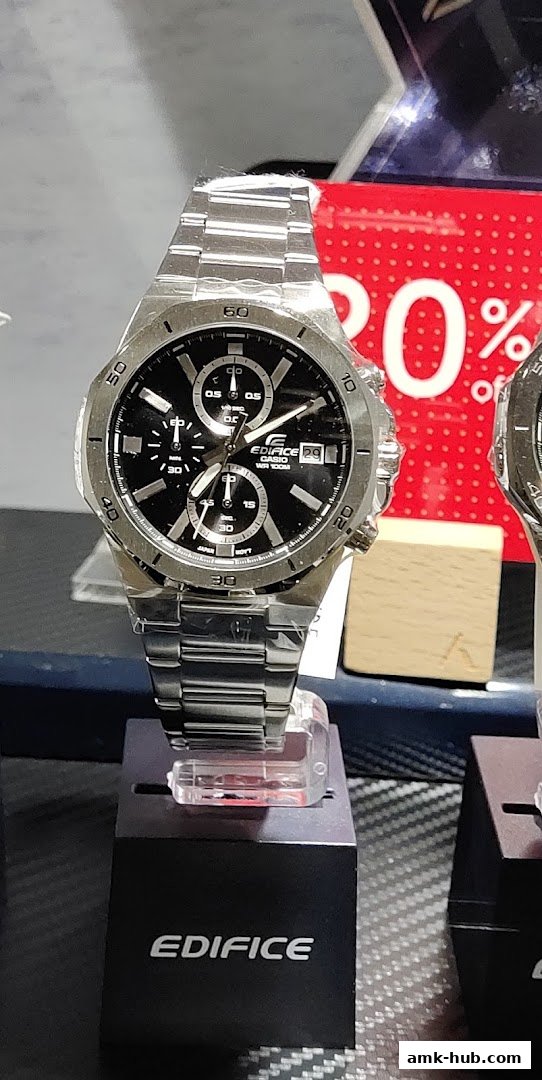 A close-up shot of a silver Edifice Casio watch with a black dial on display.