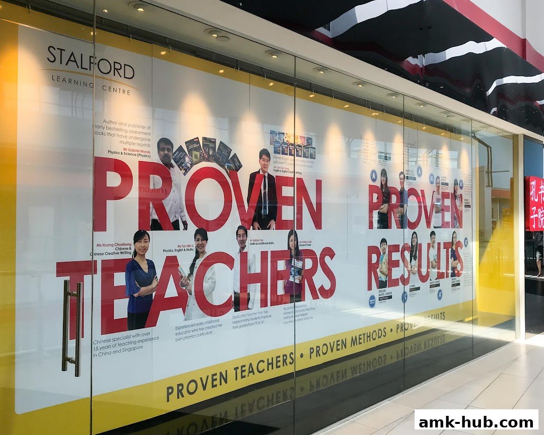 The storefront of Stalford Learning Centre, featuring large text and images of teachers.