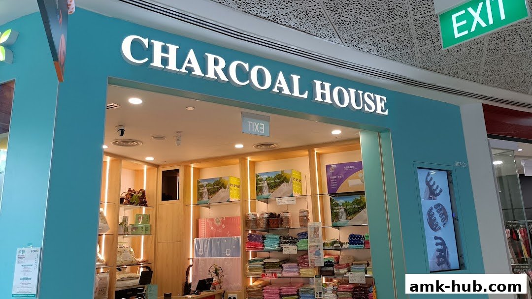 The entrance of ECOK CharcoalHouse, showcasing bedding and home goods.