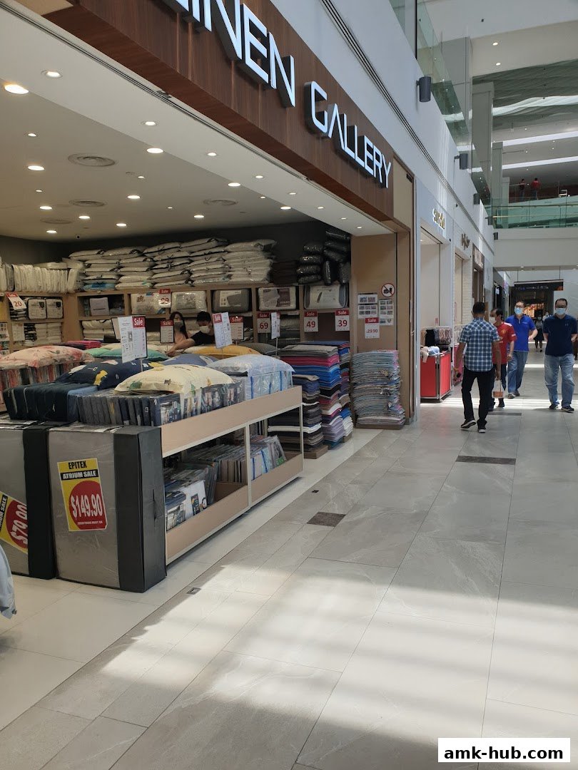 The Epitex Linen Gallery shop front displays bedding and home textiles with sale signs.