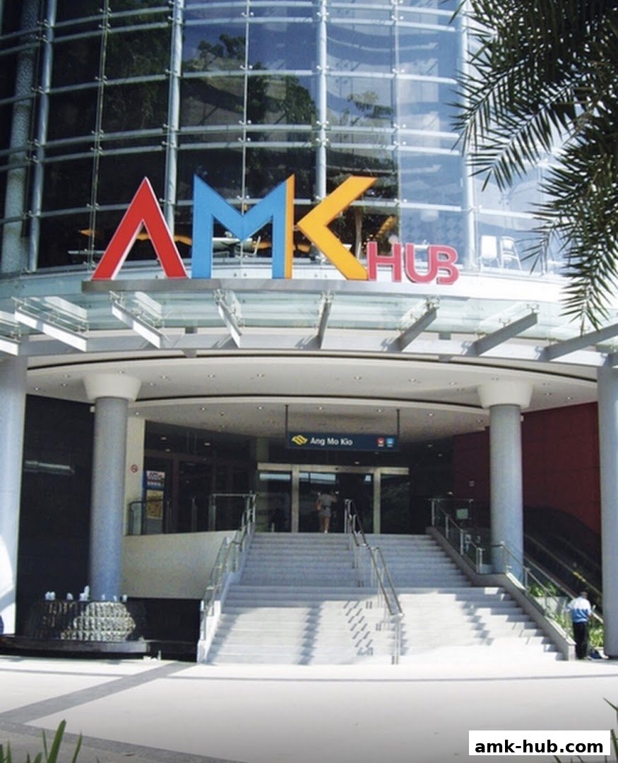 The entrance of AMK Hub shopping mall with colorful signage and stairs.