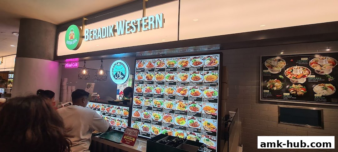 A brightly lit food stall with a large digital menu displaying various Western and Asian dishes.