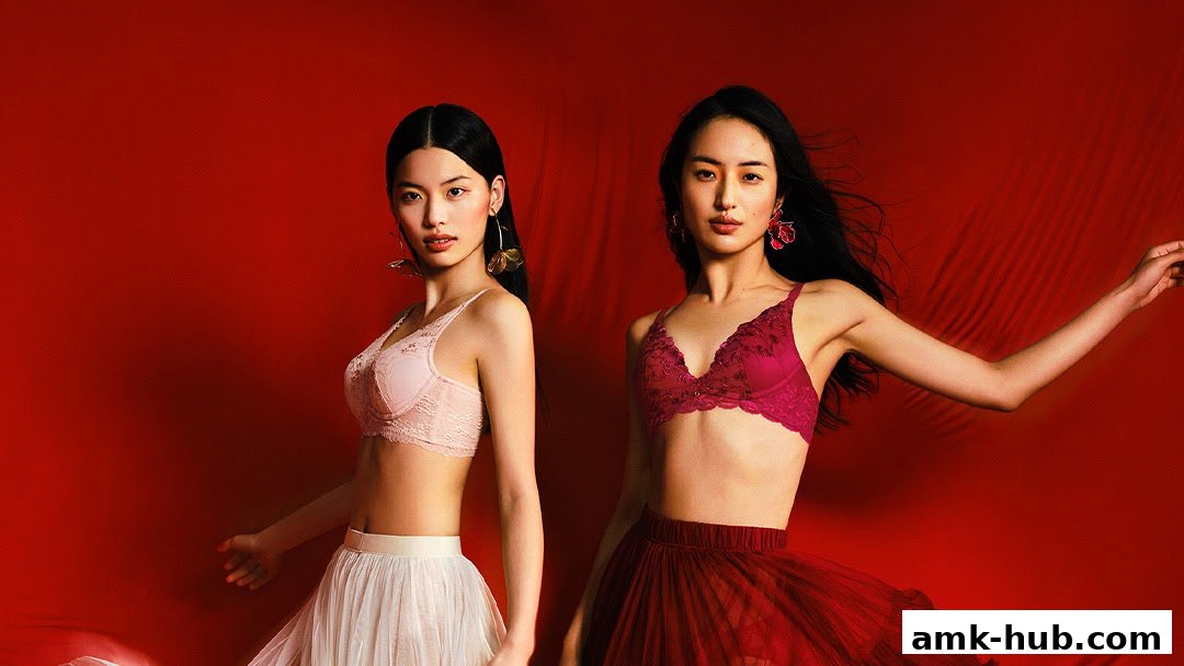 Two models showcase Triumph bras against a vibrant red background.