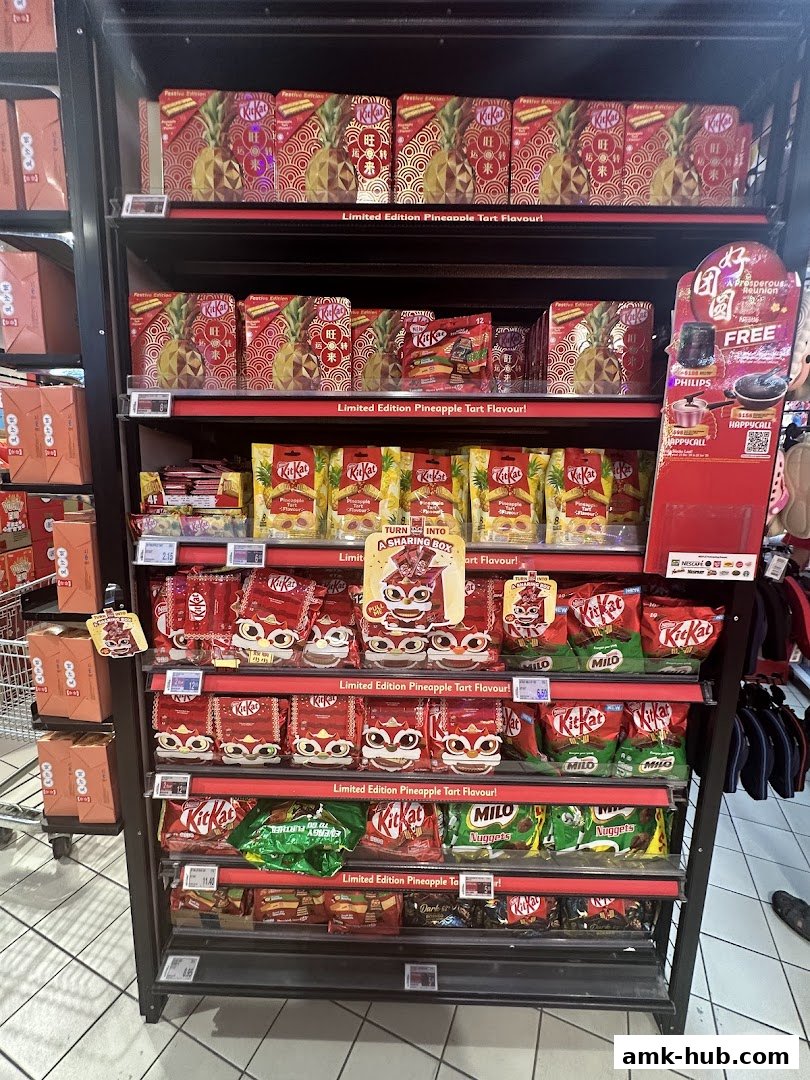A display shelf filled with various flavors of Kit Kat and Milo products, many featuring festive packaging.