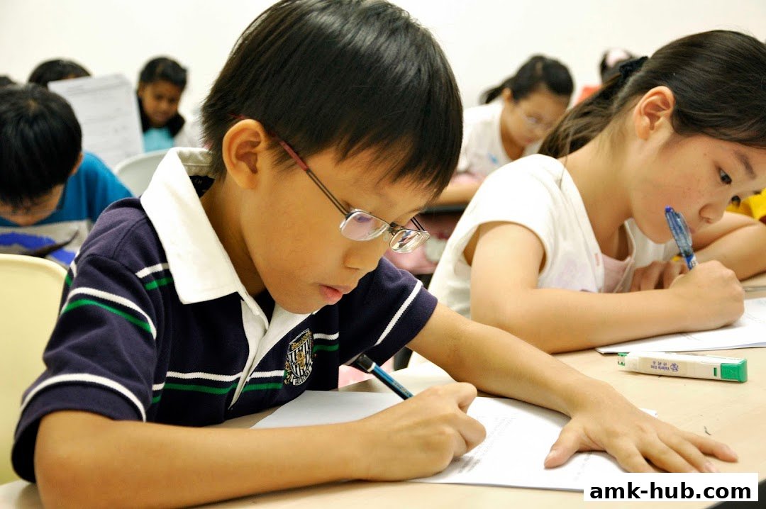 Children focused on writing during a class at Stalford Learning Centre.