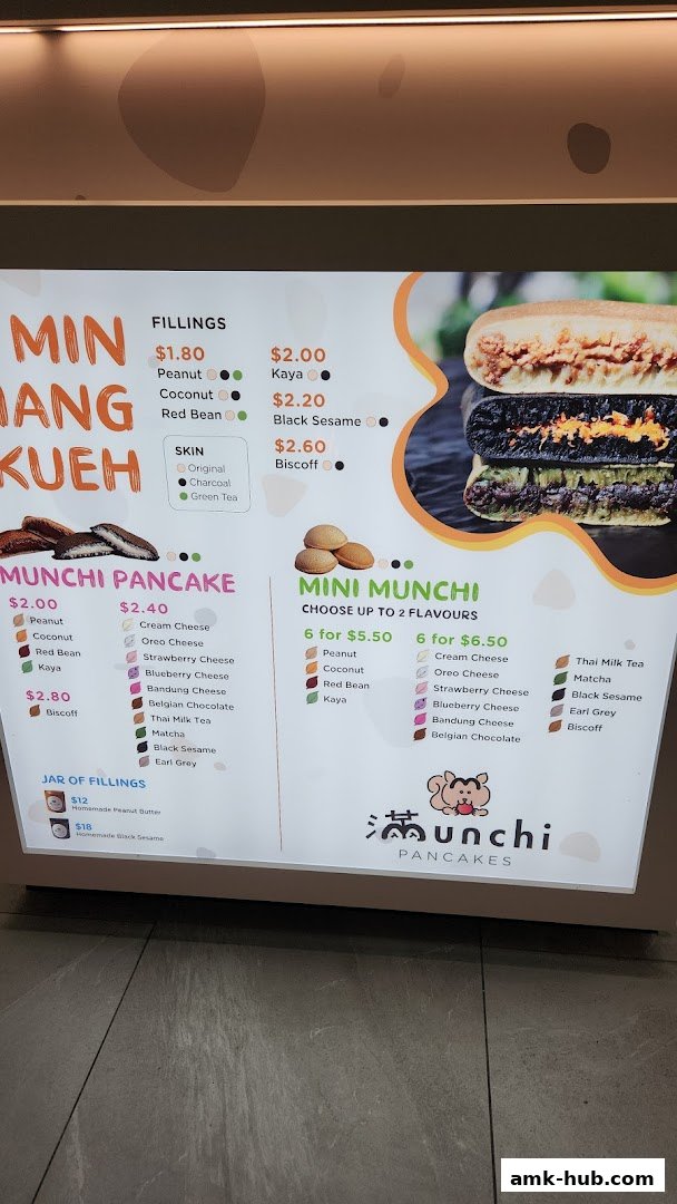 A menu board for Munchi Pancakes, showcasing various fillings and mini pancake options.