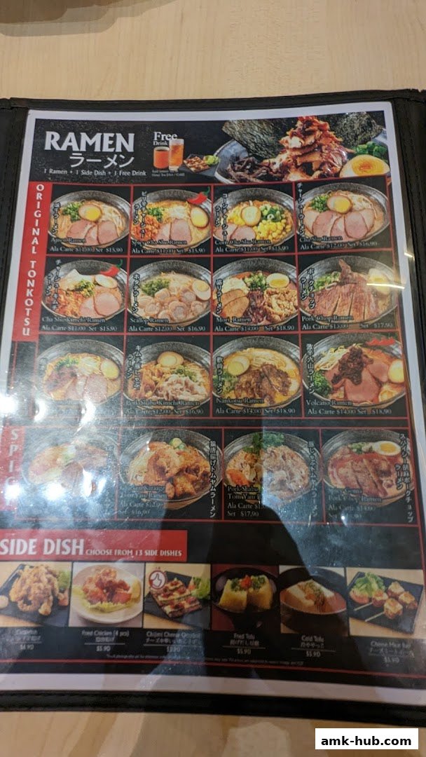 A menu featuring various ramen dishes and side dishes with enticing images.