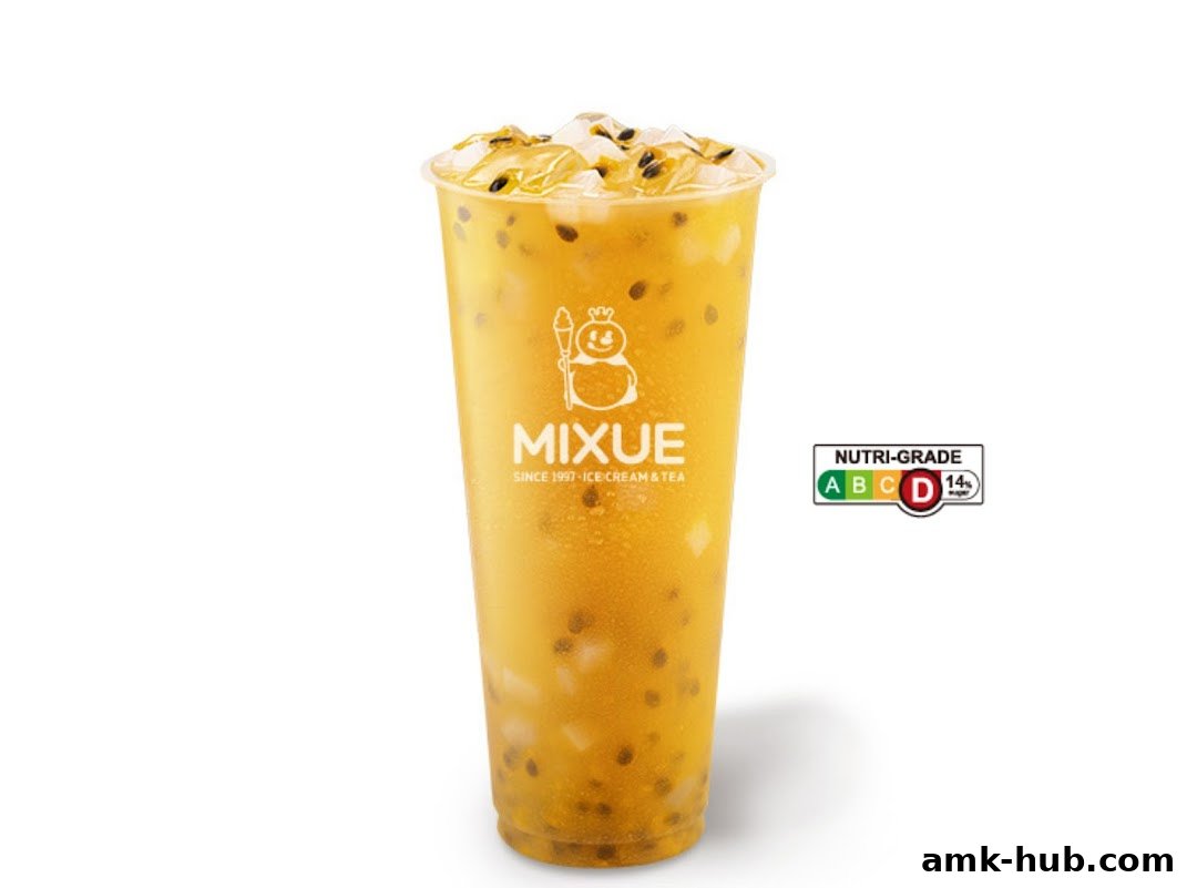 A tall cup of passion fruit iced tea with ice and passion fruit seeds, from Mixue.