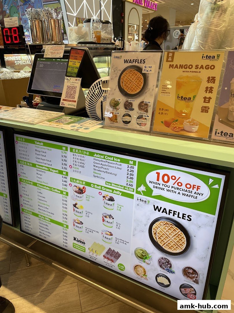 A digital menu board displaying drinks, waffles, and special offers at iTEA.