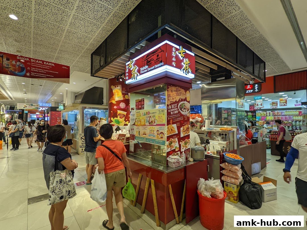 A Shihlin Taiwan Street Snacks stall in a shopping mall with customers ordering food.
