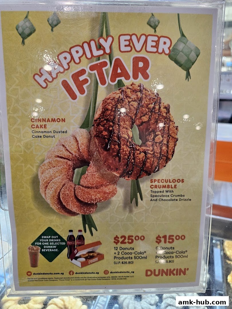 A promotional poster for Dunkin' Donuts featuring two donuts and special offers.