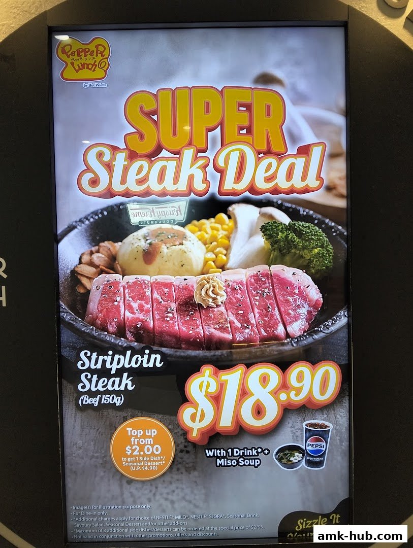 A promotional display for Pepper Lunch's Super Steak Deal featuring a striploin steak with sides.