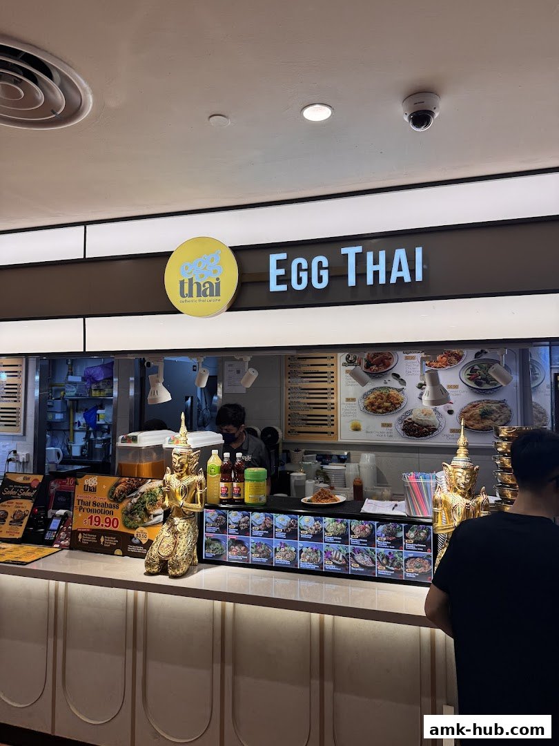 The Egg Thai shop front displays its menu and a promotion for Thai Seabass.