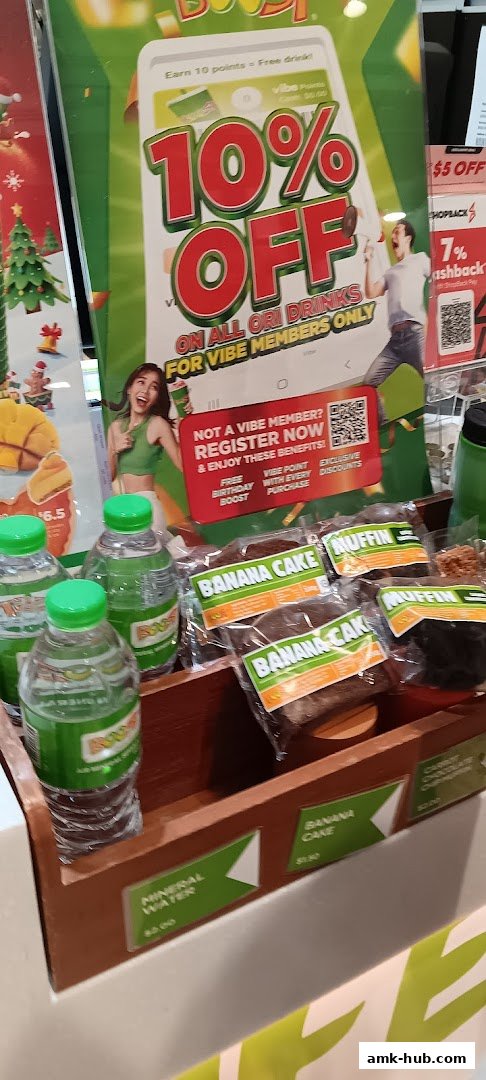 Boost Juice shop display featuring drinks, baked goods, and a 10% off promotion.