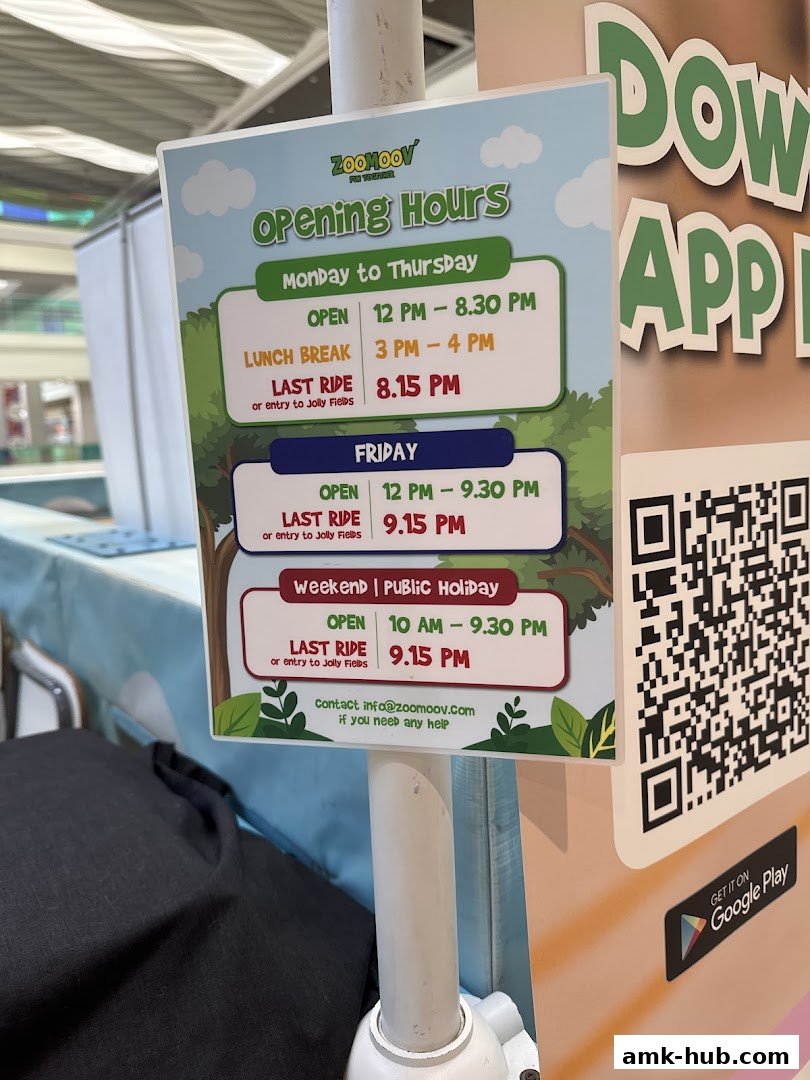 A sign displaying the opening hours for Jollyfields by ZOOMOOV.