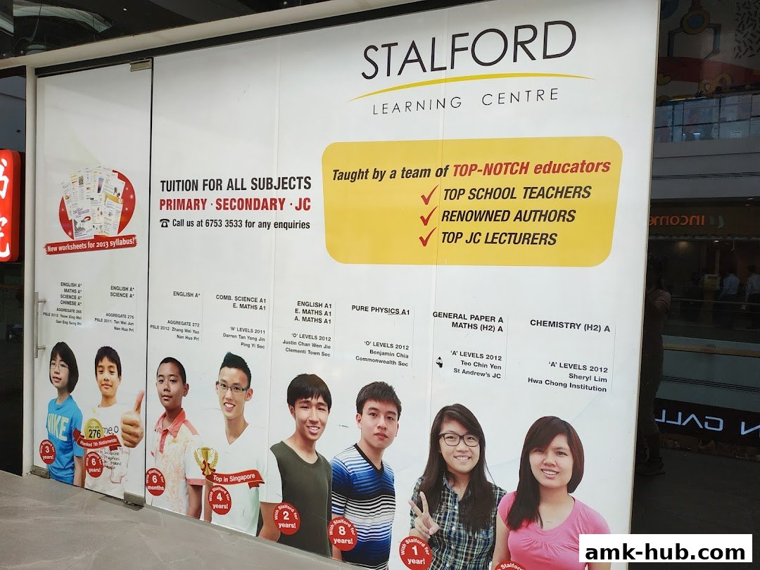 Stalford Learning Centre shop front with student testimonials and subject offerings.