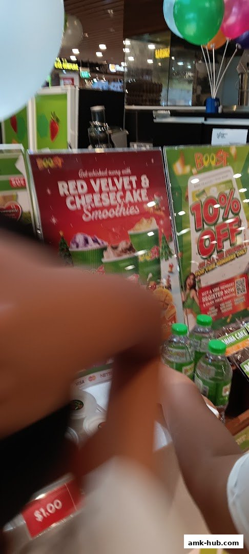 Boost Juice shop display featuring Red Velvet & Cheesecake Smoothies and a 10% off promotion.