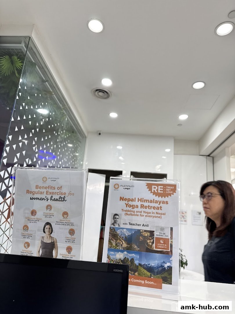 Two informational posters are displayed at the reception of Platinum Yoga Ang Mo Kio Hub.