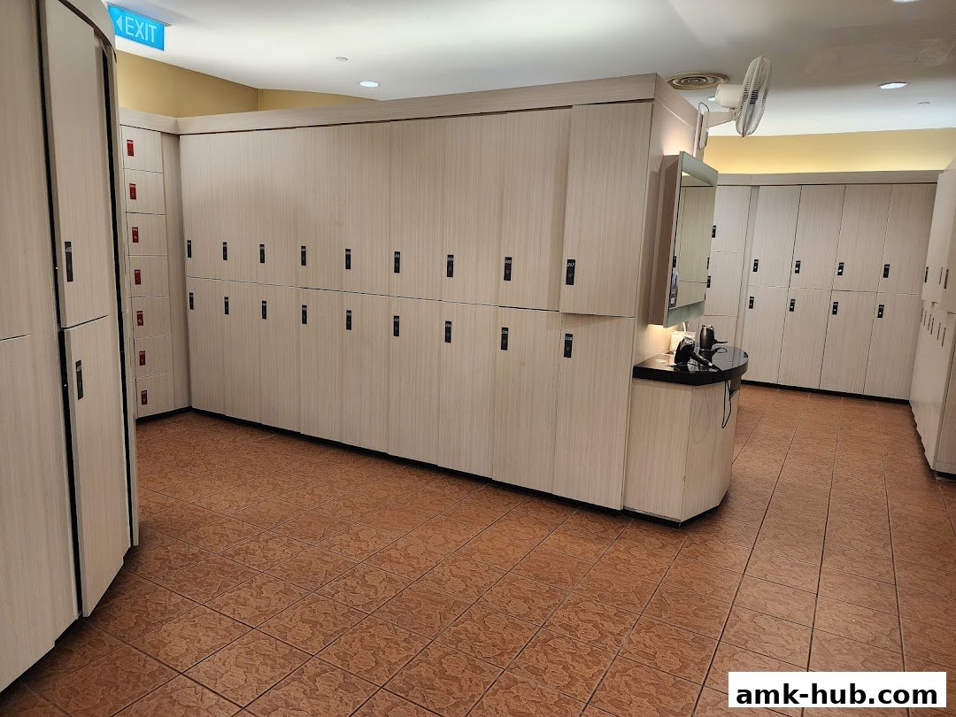 Interior view of a clean and organized locker room with rows of lockers and a vanity area.