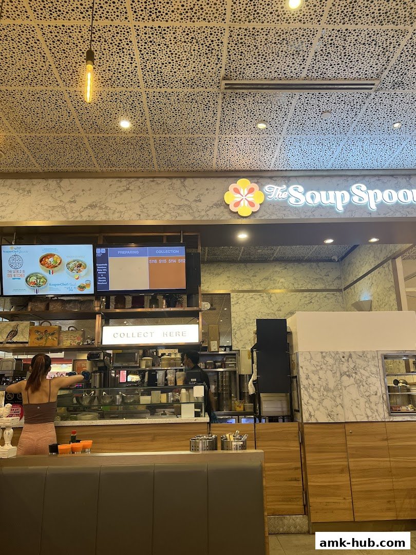 The Soup Spoon counter with staff preparing orders and a 'Collect Here' sign.