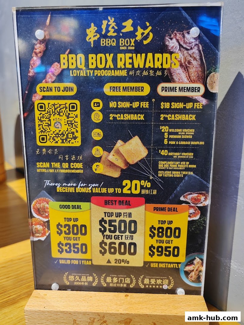 A loyalty program sign for BBQ Box, detailing membership benefits and top-up deals.