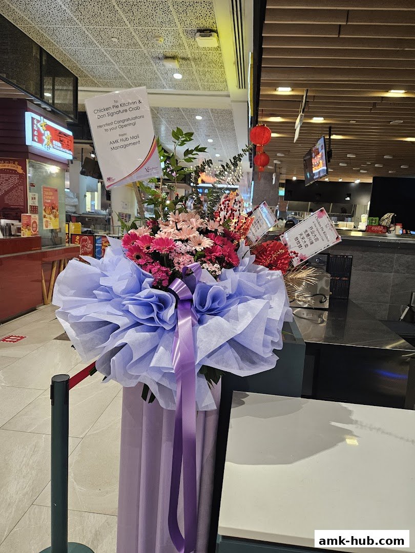 A congratulatory flower arrangement for the opening of Chicken Pie Kitchen & Don Signature Crab.