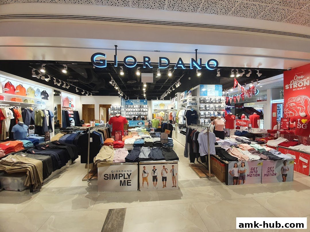 The interior of a Giordano clothing store, showcasing a wide selection of men's and women's apparel.