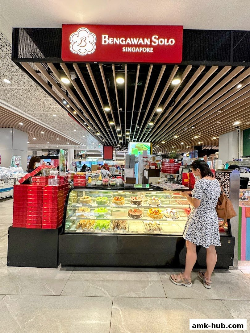 A woman looks at cakes displayed in a refrigerated case at Bengawan Solo.