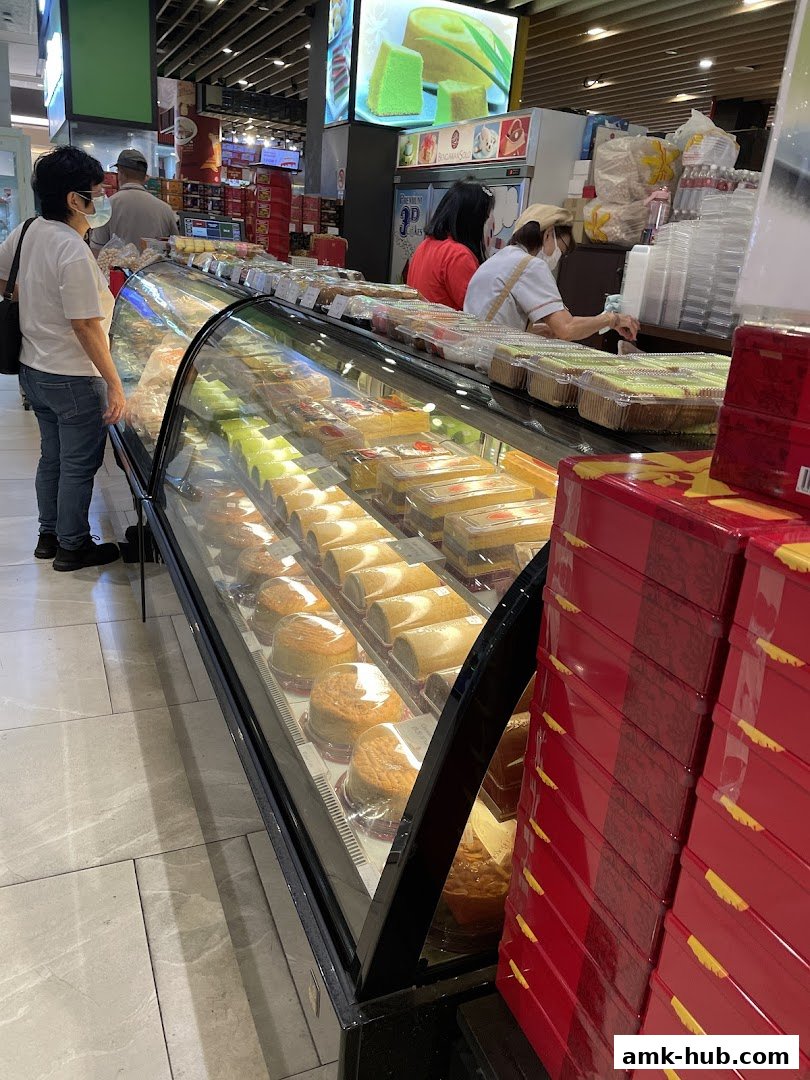 A display case filled with various cakes and pastries at Bengawan Solo.