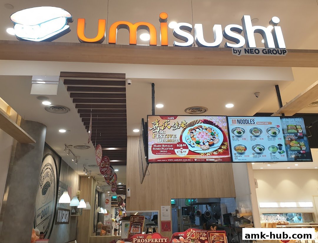 The exterior of an Umi Sushi restaurant with its prominent signage and digital menu boards.
