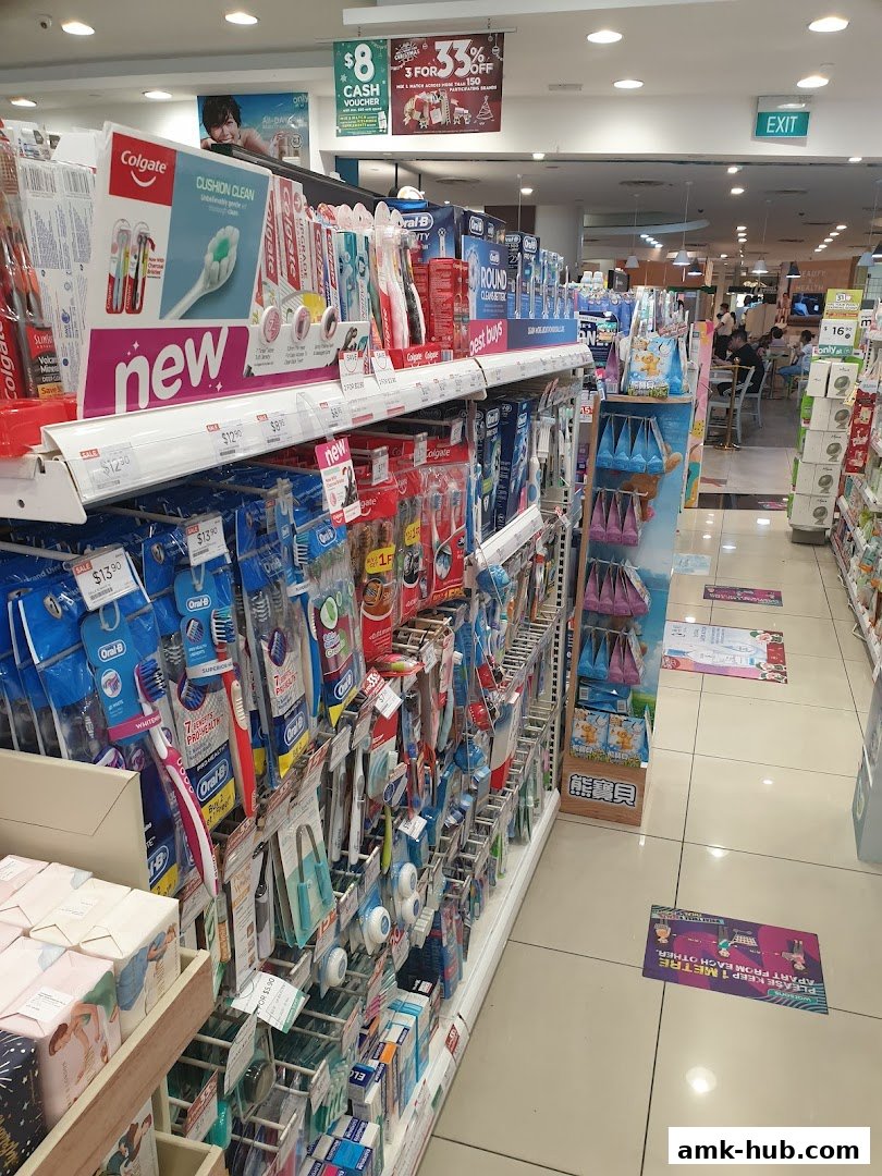 Aisle of toothbrushes and oral care products in a Watsons store.