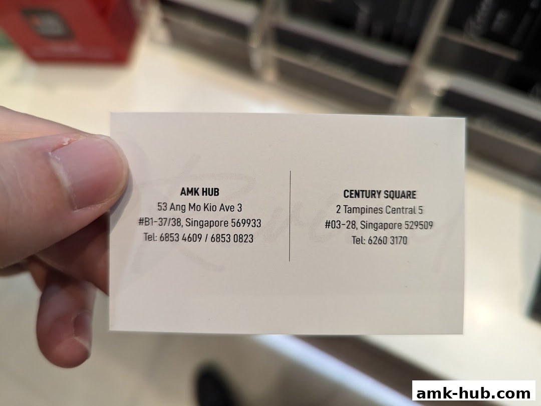 A business card with contact information for two locations of Revival Hair Gallery.
