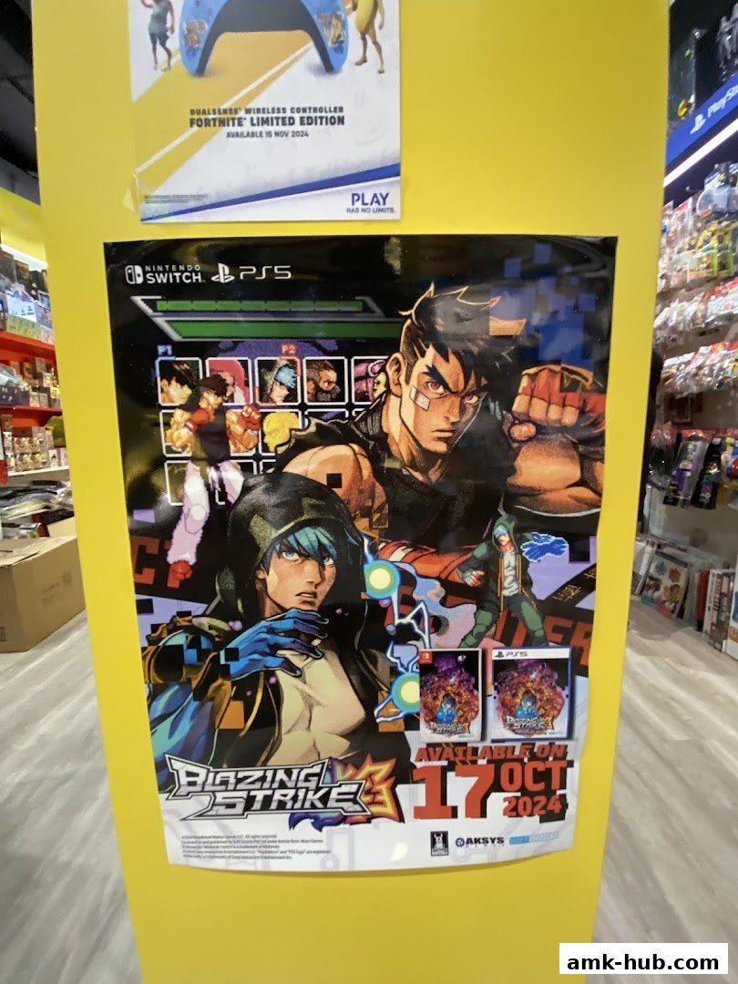 A poster for the game Blazing Strike is displayed on a yellow wall, with other game posters and merchandise visible.