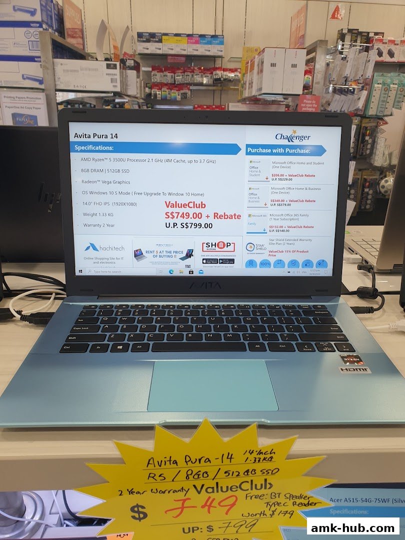 A light blue Avita Pura laptop is displayed on a counter with product specifications and pricing.