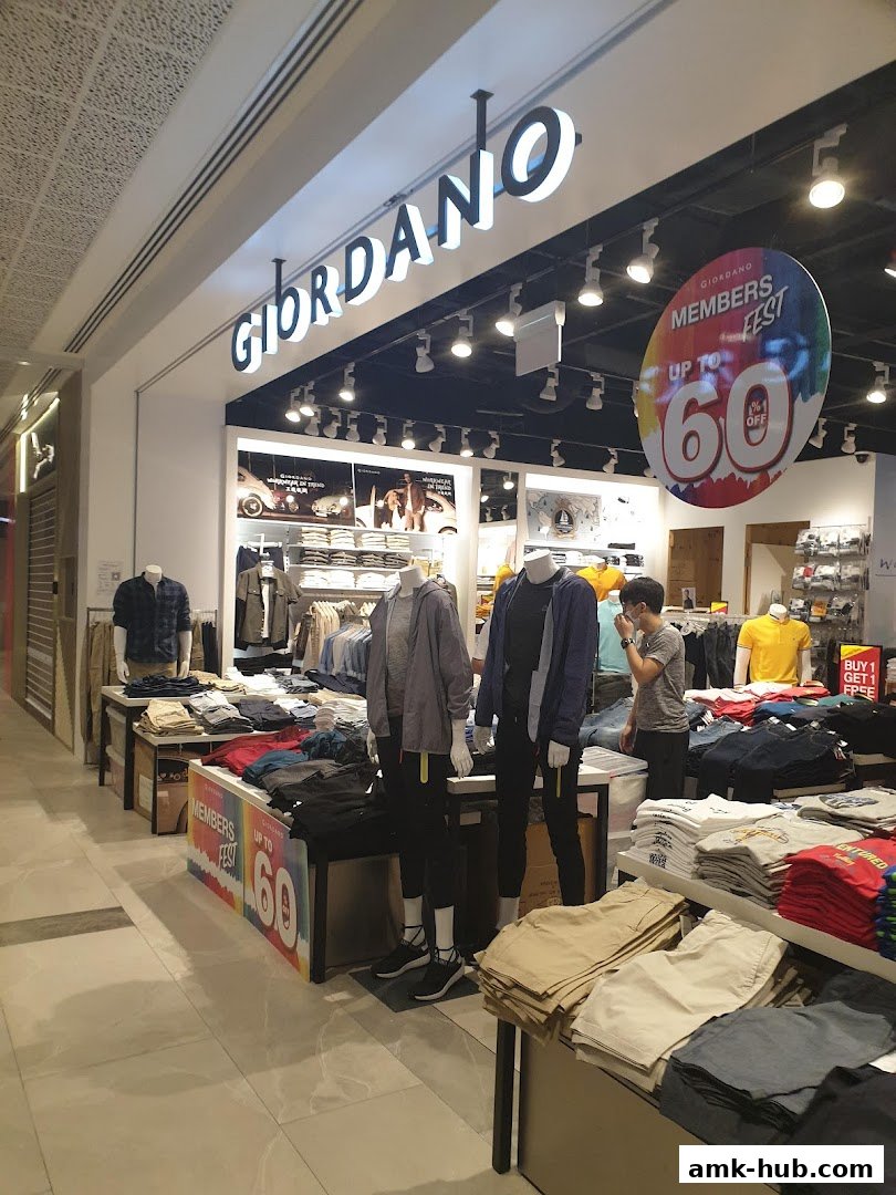The Giordano store entrance displays mannequins and folded clothing, with a 'Members Fest' promotion.